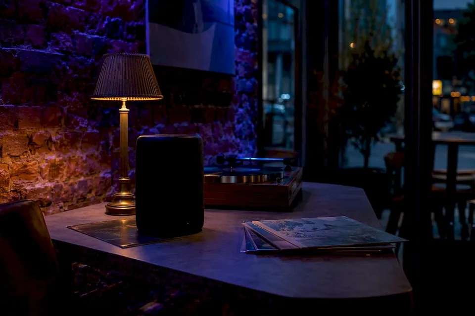 Speaker in dim lit cozy listening space