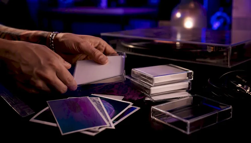 Hands preparing music release materials