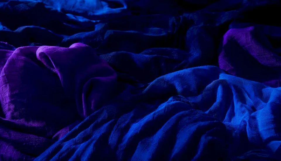 Abstract fabric and colored lights representing playlist moods