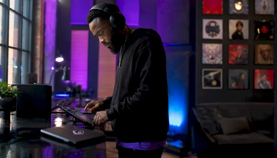 Music producer reviewing Spotify playlists